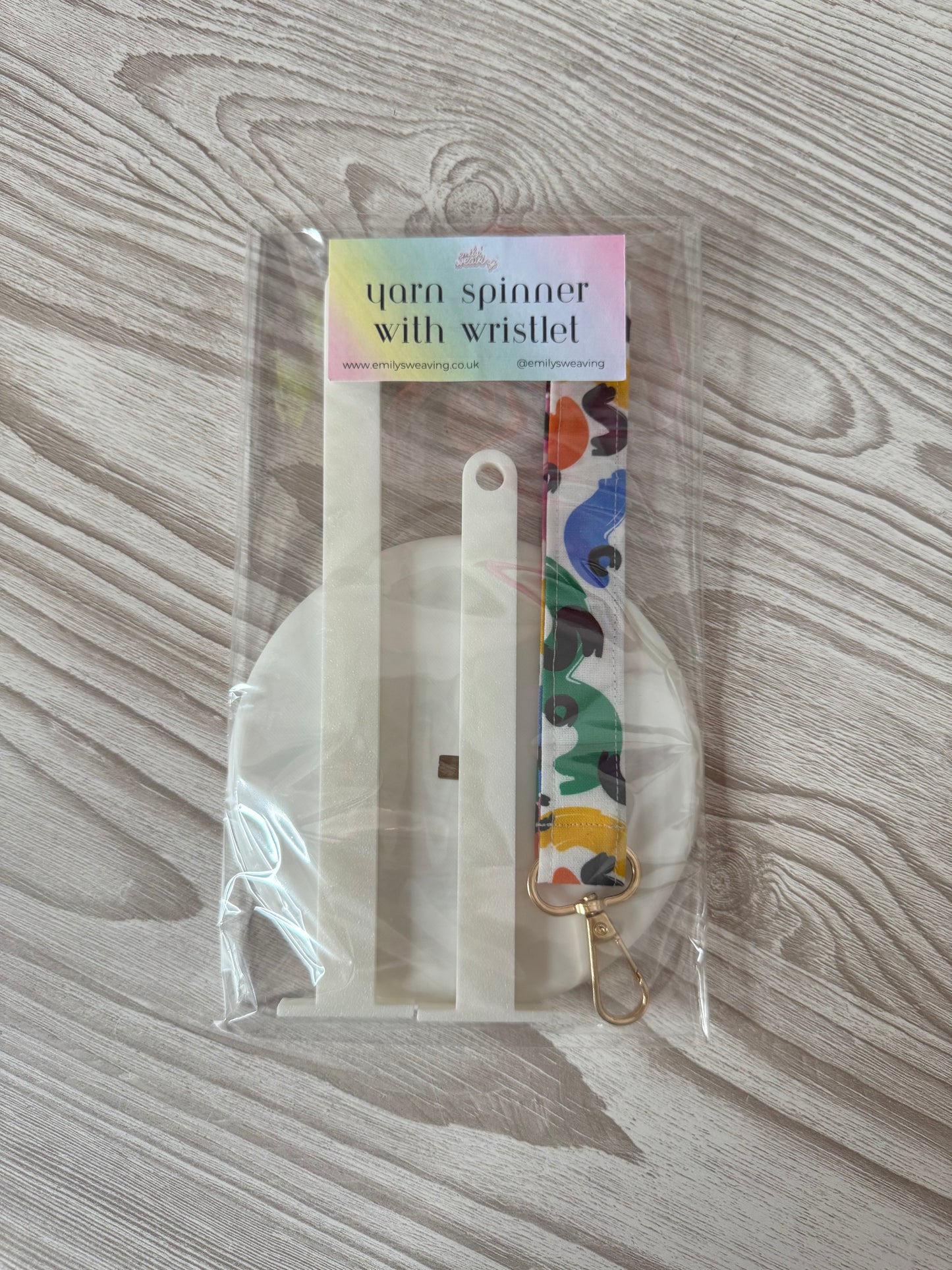 White Yarn Spinner with Abstract Wristlet