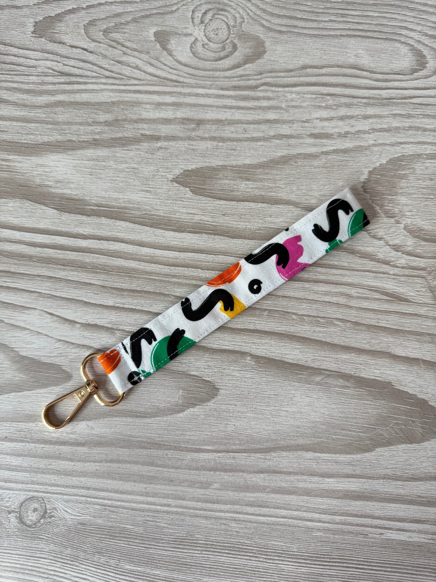White Yarn Spinner with Abstract Wristlet
