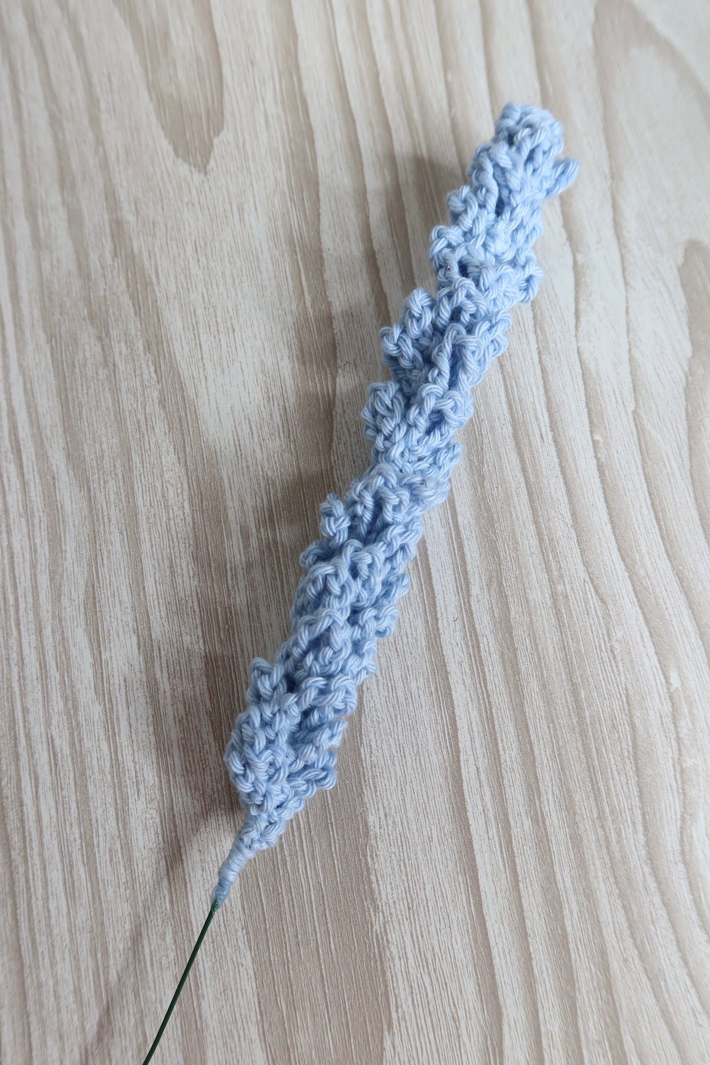 A single crochet lavender stem in sky blue