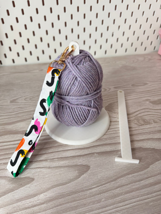 White Yarn Spinner with Abstract Wristlet